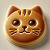 ふっくら焼き上がった猫の顔どら焼き、まんまるな瞳と愛らしいひげ模様が特徴 Fluffy cat face dorayaki with round eyes and charming whisker details