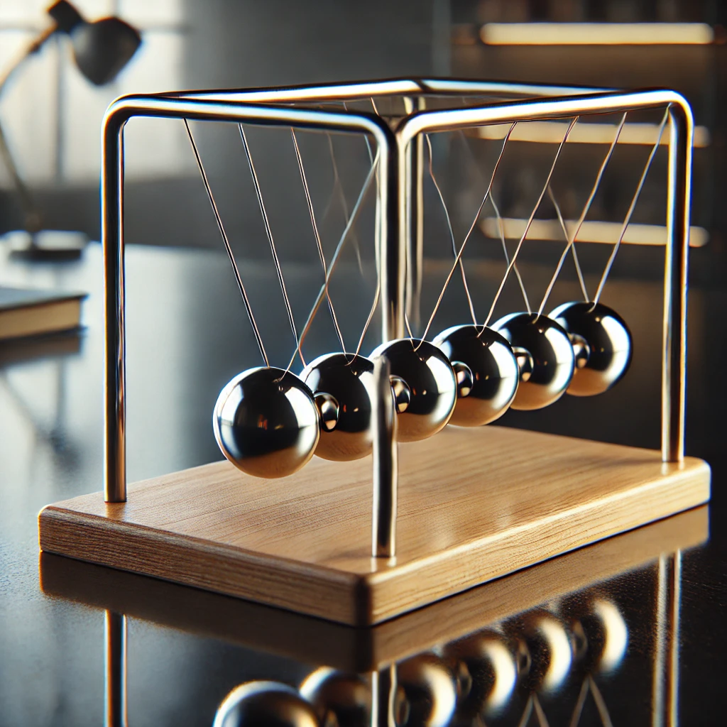 木製台座の上に設置されたニュートンのゆりかごが一つの球を持ち上げた状態で静止している Newton's cradle with a wooden base, one ball lifted to the side in a resting position